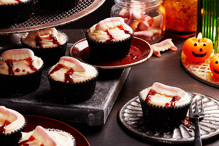 vampire bite cupcakes served on vampire theme based decorated table