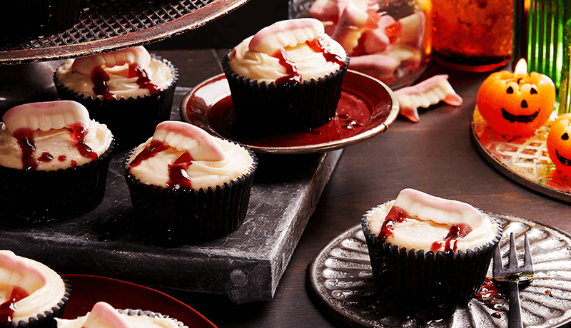 vampire bite cupcakes served on vampire theme based decorated table